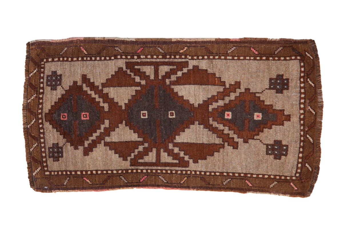 Vintage distressed Kars rug with a large stepped geometric medallion in copper, bronze, and silver tones.