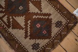 Evenly worn, hand-knotted pile on the corner of a geometric vintage Kars rug.