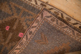 Distressed vintage Kars rug showing low brown pile, pink geometric blossoms, and hand knotted reverse.