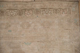 Detail of the vintage Oushak rug's low pile with even wear and surfaced dark wefting.