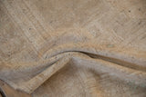 Surfaced dark wefting visible within the soft, hand-knotted pile of a vintage Oushak rug.