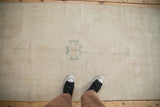 Vintage distressed Oushak runner viewed from above, showing the soft, evenly worn texture.