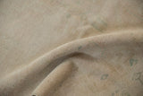 Reverse view of a vintage Oushak rug showing its tightly woven hand-knotted foundation.