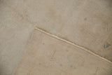 Back of a vintage Oushak runner showing its hand-knotted foundation and secure machine-bound side.