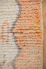Plush, hand-knotted texture of a Moroccan runner with sun-softened terracotta and saffron wool.
