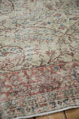 Distressed vintage Sparta rug showing even wear to the knot heads on its silver and red pile.