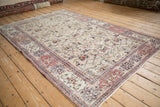 Distressed vintage Sparta rug corner, with dusty red Samovar Turtle border and lattice field.