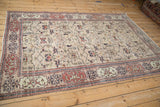 Distressed vintage Sparta rug detail with dusty cherry red Samovar Turtle border and beige field.