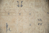 Detail of the distressed texture showing worn knots and visible foundation on a vintage Sparta rug.