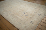 Angled view of the vintage Sparta carpet highlighting its time-softened low pile.