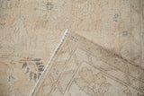 Hand-knotted foundation and machine-bound edge on the back of a vintage Sparta carpet.