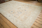Distressed texture and faded navy floral designs on a vintage Sparta carpet.