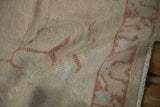 Distressed Oushak runner texture, even wear, ivory, pale copper, blue tones, machine-bound edge.