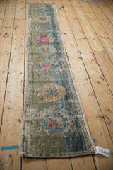 Vintage distressed Oushak runner with faded floral motifs and unique abrash patina.