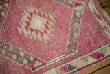 Close-up showing the evenly worn, hand-knotted pile of a distressed Kurd rug runner.