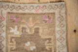 Short, even pile and meandering vine border of a vintage Kars rug with magenta and orange accents.