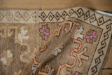 A vintage Kars rug folded to display its flexible hand-knotted weave and short, even pile.