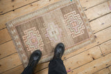 Heavily abrashed ground and geometric hook and latch relief on vintage Kars rug.