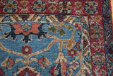 Close-up on the plush pile of a vintage Bibikabad rug corner with floral and vine borders.