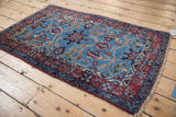 The fine, plush pile and meandering vine border on a vintage Bibikabad rug corner.