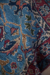 Soft fold showing the plush, thick hand-knotted pile of a vintage Bibikabad rug.