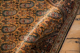 A folded corner showing the fine weave and crisp, even pile of a vintage Persian Sarouk rug.