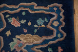 Art Deco runner detail: undulating river border, blue ground, pastel blossoms and leaves.