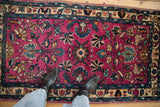 Vibrant magenta pile of a vintage Lilihan rug with floral motifs in deep indigo and jade green.