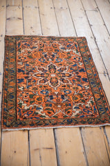 Secured cream fringe and thin banded floral border of a hand knotted Persian Hamadan rug.