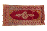 Vintage Anatolian rug mat, black cherry red abrashed field, central medallion, and vine borders.