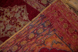 Hand-knotted Vintage Anatolian rug detail with black cherry red, saffron, sapphire border and aged selvedge.