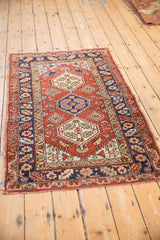 Vintage Heriz rug with a low, even pile highlighting its intricate geometric triple medallion design.