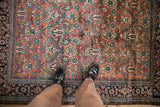 Overhead view of the intricate Tree of Life and Turtle Samovar motifs on a vintage Persian rug.