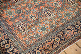 Close-up view of the intricate Turtle Samovar border on a vintage hand-knotted Bibikabad rug.