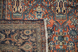 Corner of a vintage Bibikabad rug showing the wool pile and hand-knotted foundation.