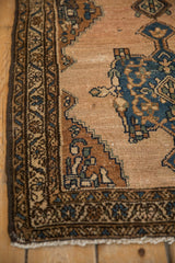 Vintage Mehriban rug's meandering vine border and faded, abrashed field.