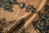 Textured vintage Mehriban rug pile with subtle dusty blue, bronze, and beige geometric motifs.