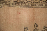 Sandalwood field of the vintage Tabriz rug showing a reddish blemish and subtle pile wear.