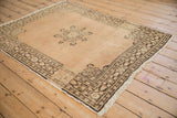 Mostly even wear on vintage Tabriz rug, with abrashed sandalwood field and quatrefoil medallion.