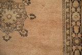 Vintage Tabriz rug detail with sandalwood field, coffee brown palmettes, and intricate border.