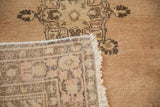 Hand knotted reverse and fringe of Vintage Tabriz rug, showing dusty rose and coffee brown patterns.