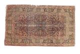 Antique Persian Kerman rug, cochineal red tree of life medallion, ivory field, visible patina.
