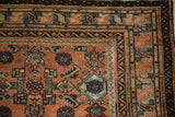 Terracotta and sapphire blue Herati pattern on Malayer rug with distinct geometric borders.