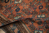 Folded vintage Malayer rug pile, Herati pattern in madder root red and sapphire blue.