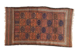 Antique Belouch rug, rows of ram's horn guls in madder red, aubergine, and cobalt blue.
