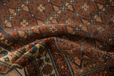 Textured pile of the vintage Kurdish Hamadan runner, showing blue border and floral field.