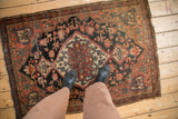 Vintage Josan Sarouk rug underfoot, with central red medallion, deep blue field, and beige patterns.