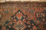 Vintage Josan Sarouk rug, madder root red border with vine blossoms, showing top edge wear.