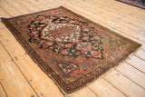 Vintage Josan Sarouk rug main border, meandering vine blossoms, red and navy field.