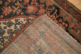 Vintage Josan Sarouk rug revealing rich red, navy floral pile and hand-knotted construction.